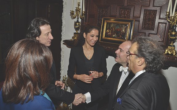 Maestro Miceli (second from right) greeting guests.